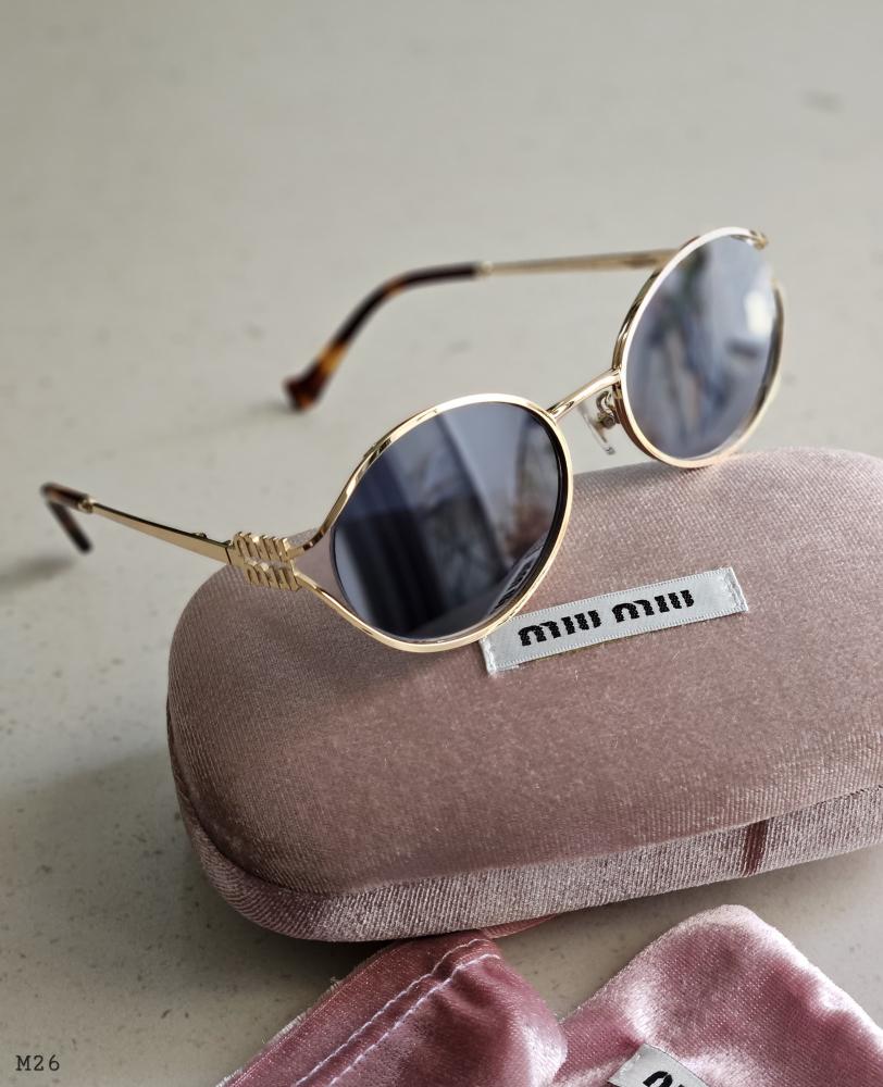 miumiu ブラック サングラス ゴールド装飾 Miu Miu MU 50ZS Irregular Sunglasses | EyeOns.com
