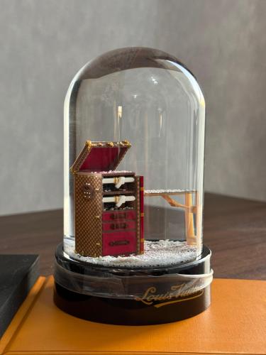 Louis Vuitton miniature snow globe in a miniature travel box