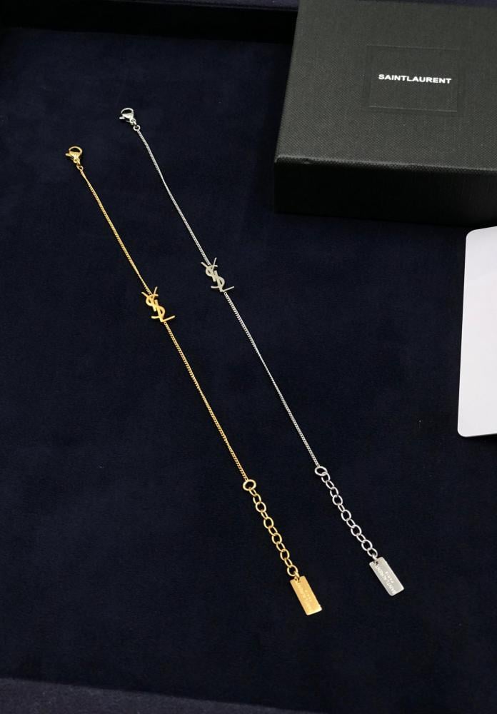 Yves Saint Laurent bracelet, delicate chain, elegant gold