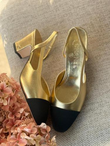 Chanel heeled sandal with a metallic gold elastic back strap - E