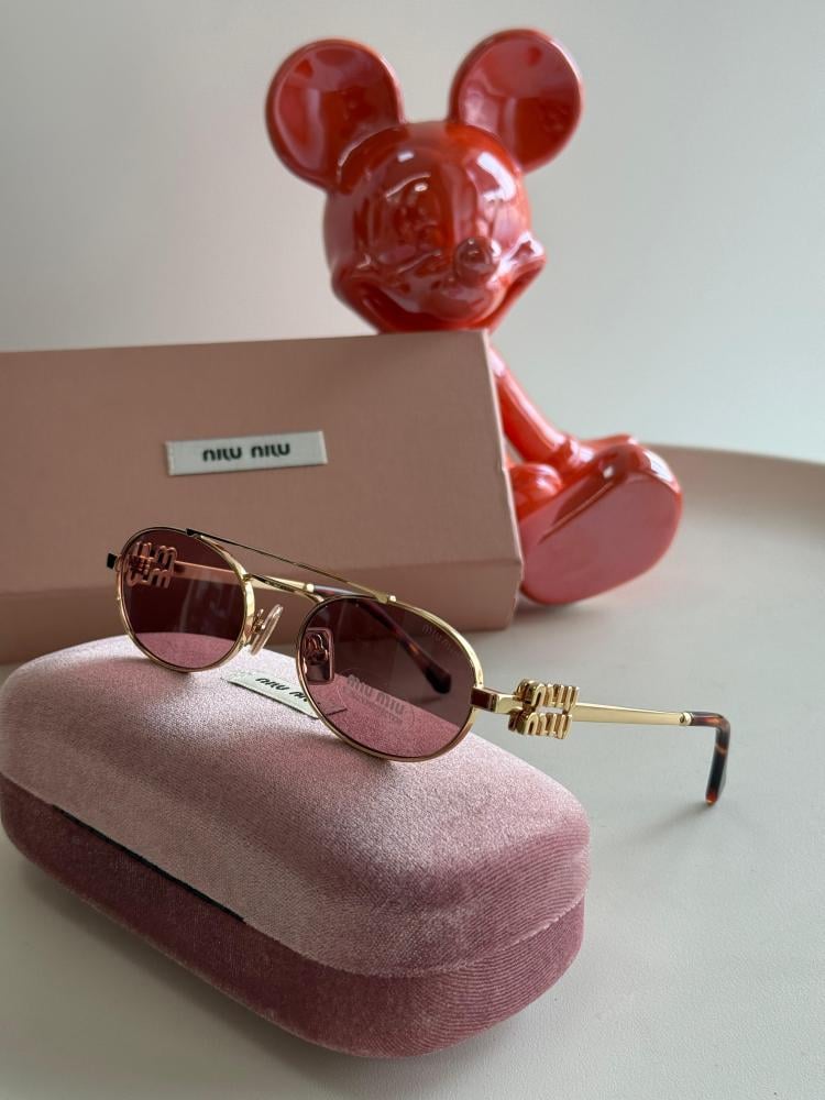Miu Miu oval sunglasses in pink and gold