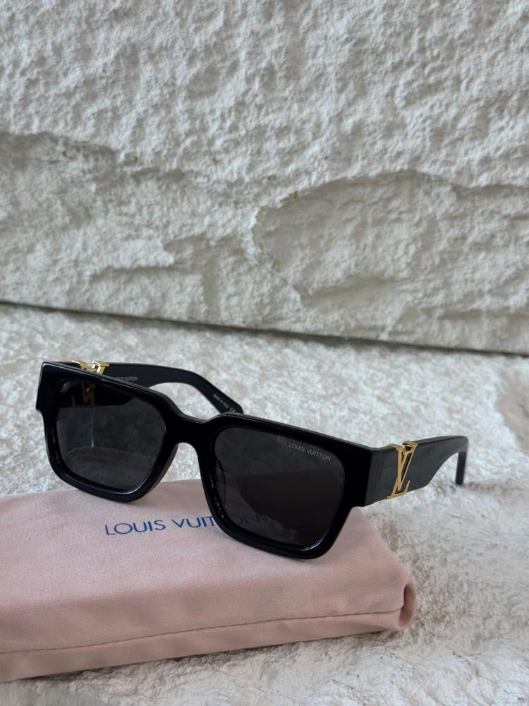Louis Vuitton sunglasses with a black square frame and a gold logo