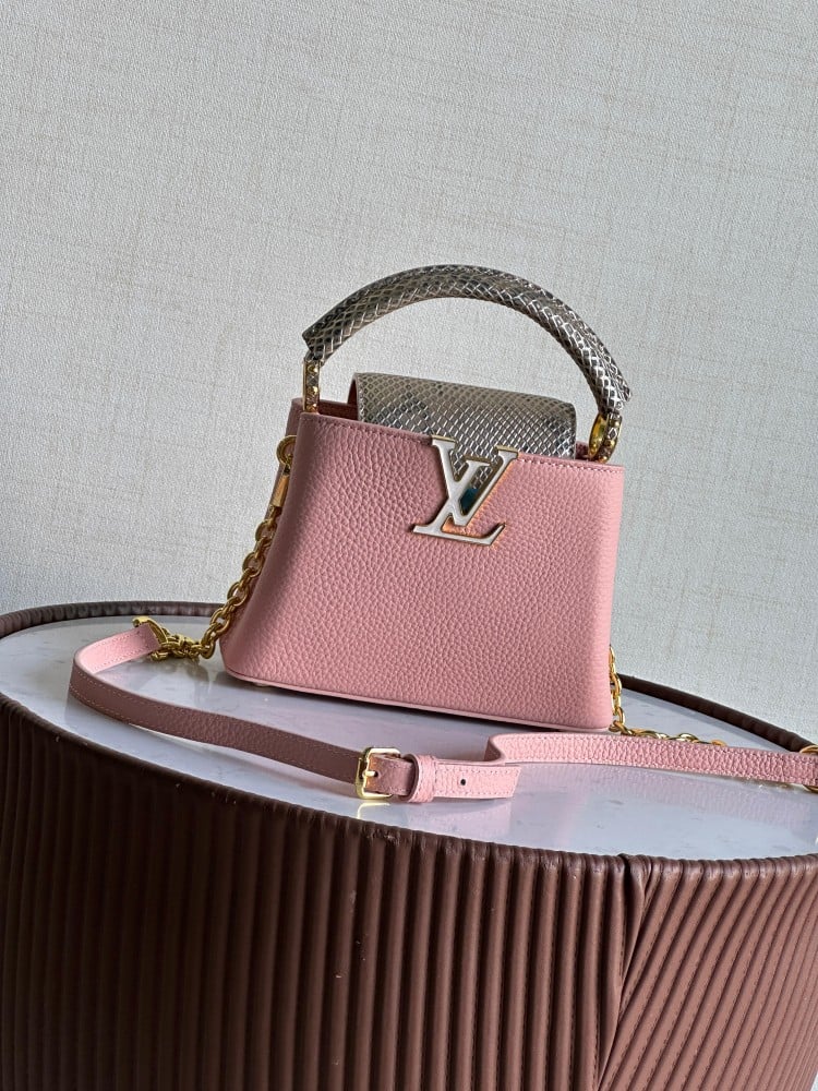 Louis Vuitton women's bag, elegant, in a distinctive light pink color