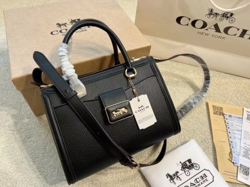حقيبة كوتش cary all قماش أسود فاخر مع مقبض وحزام