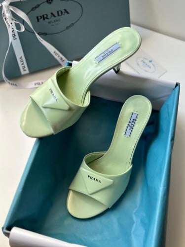 Prada mid-heel flip-flops, distinctive design, light green color