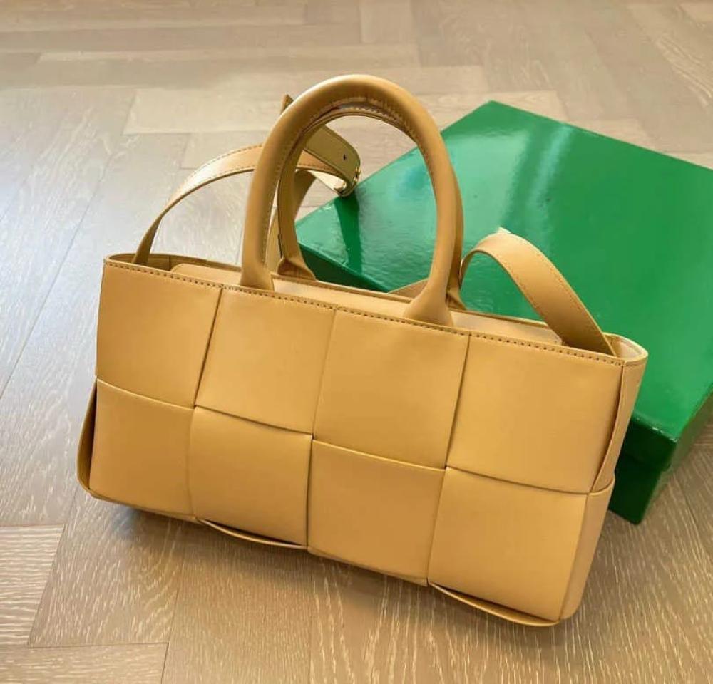 Bottega Veneta leather bag with top handles and shoulder strap, honey