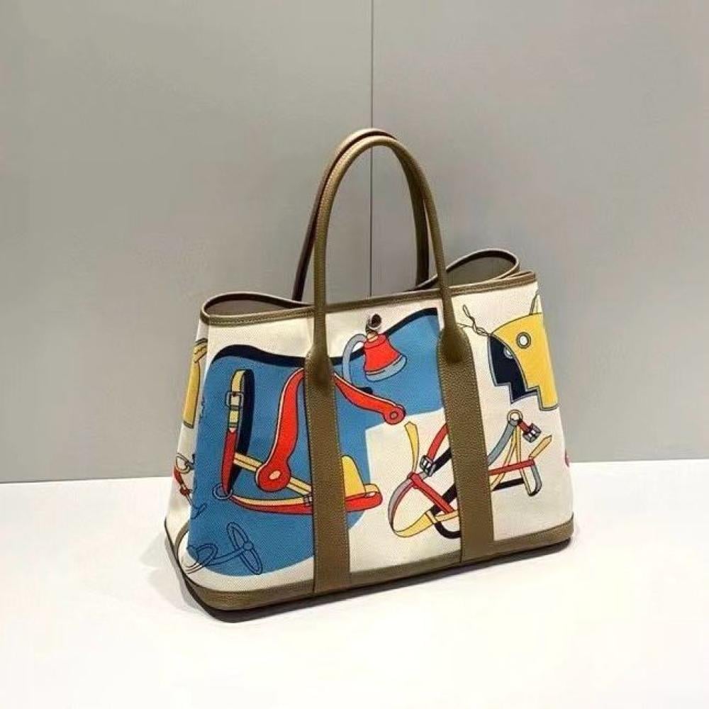 Hermes Garden Party Voyage Bag in a colorful print with olive leather