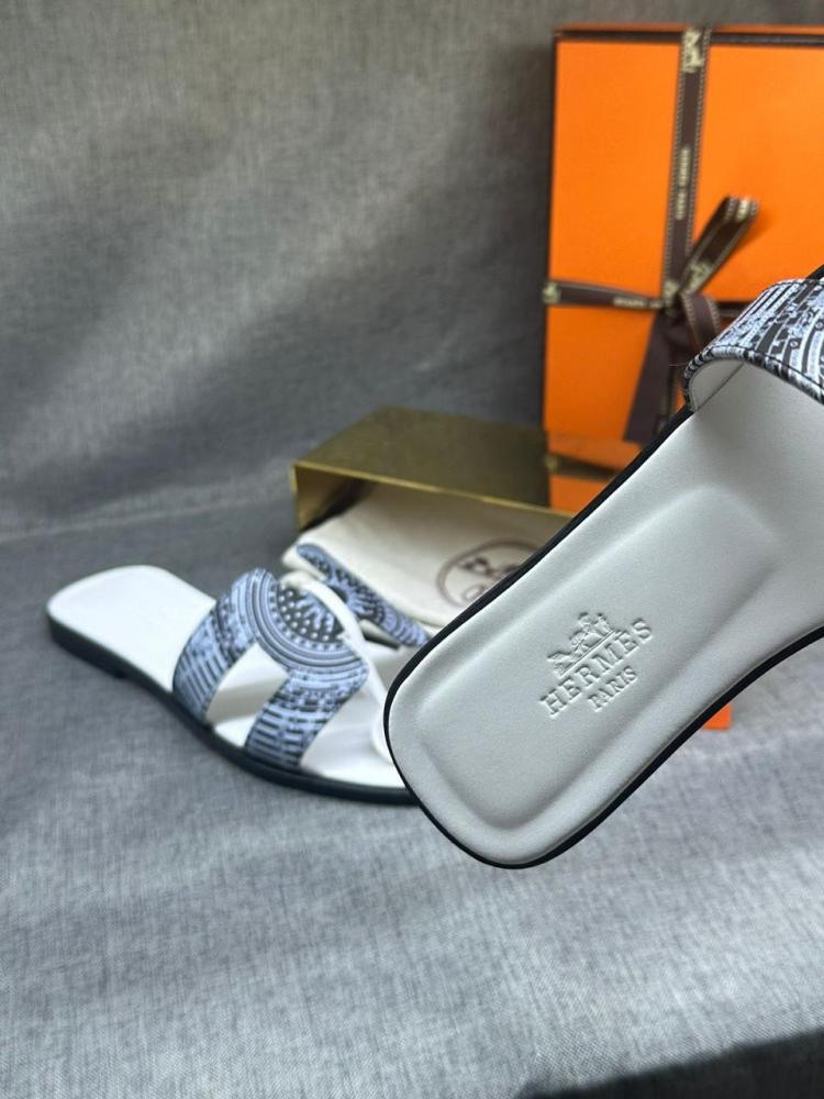 Hermes women's leather slippers with a distinctive light