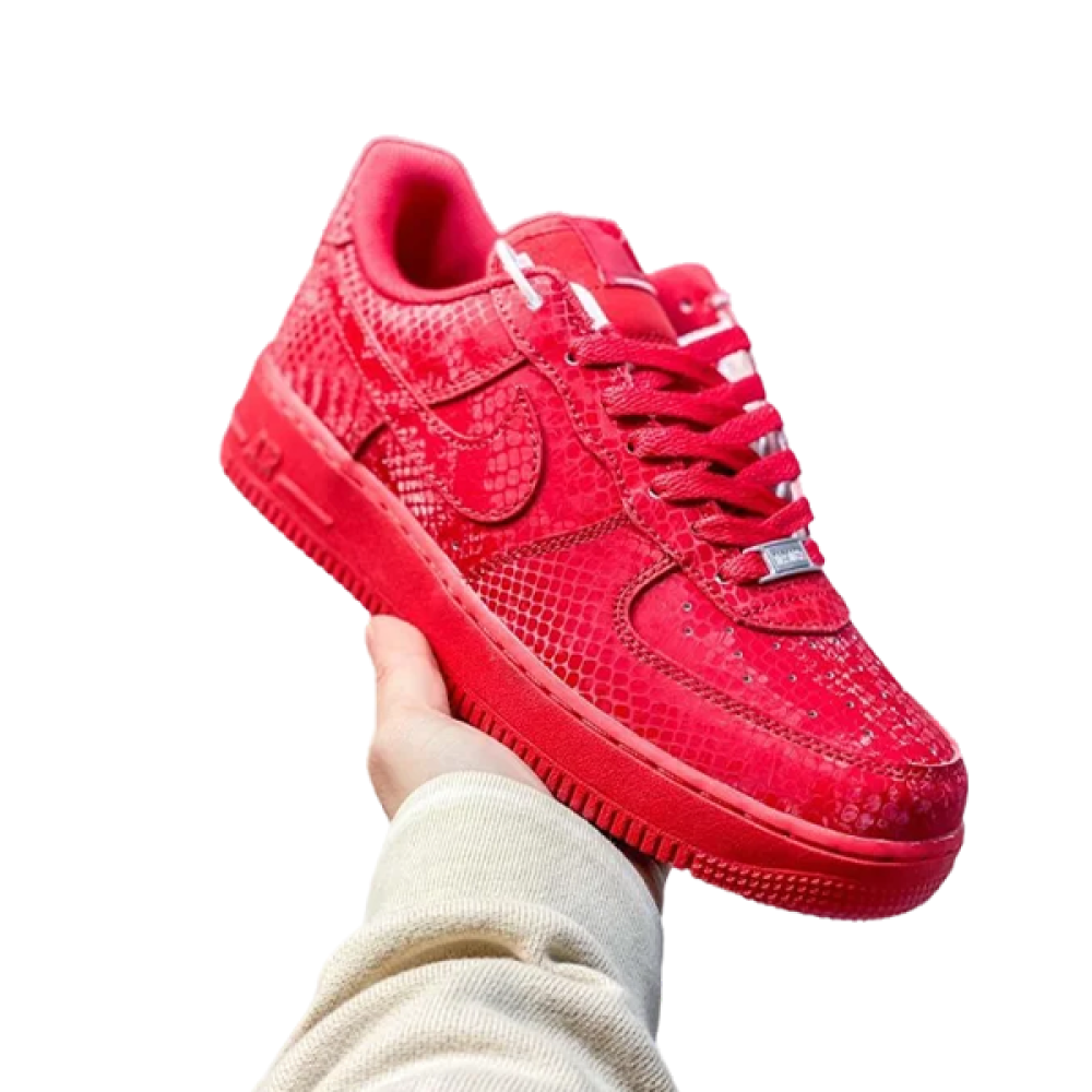 Nike Air Force 1 Low basketball shoes in red with a snakeskin
