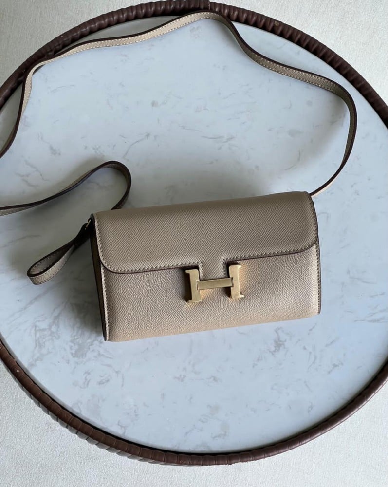 Hermes Constance women's bag in elegant beige with the golden Hermes logo