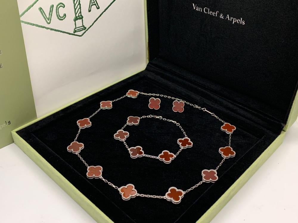 Van Cleef & Arpels Alhambra necklace with brown bracelet
