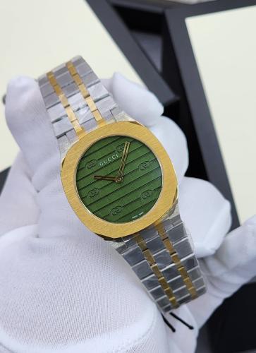 Gucci H25 Women's Watch in Gold and Silver with Green Dial - E