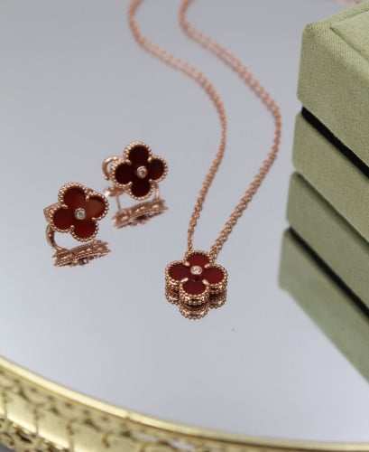 Van Cleef & Arpels' famous Alhambra flower accessory, red