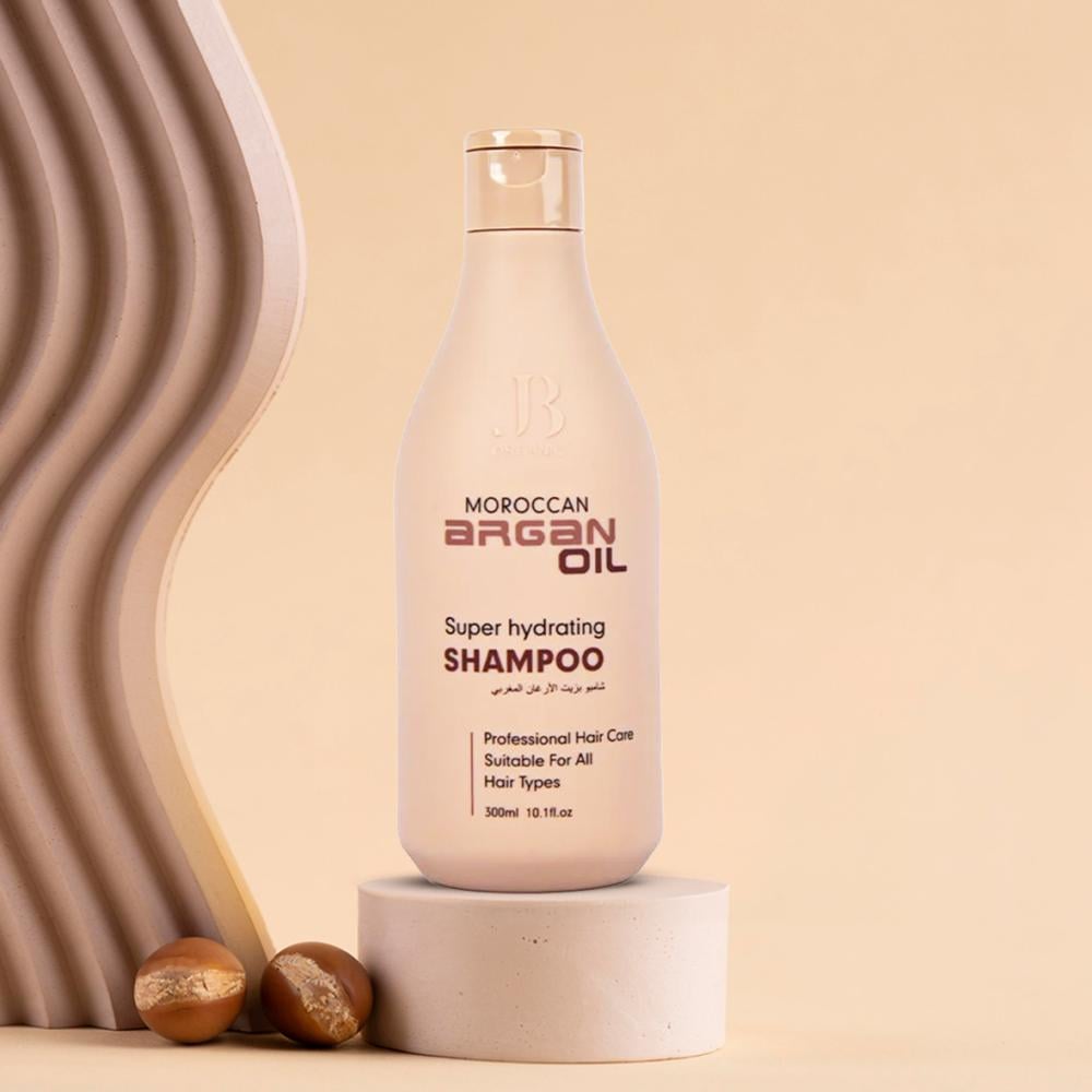 شامبو جي بي أورجانيك بزيت الأرغان للعناية بالشعر التالف - لمسة ستور