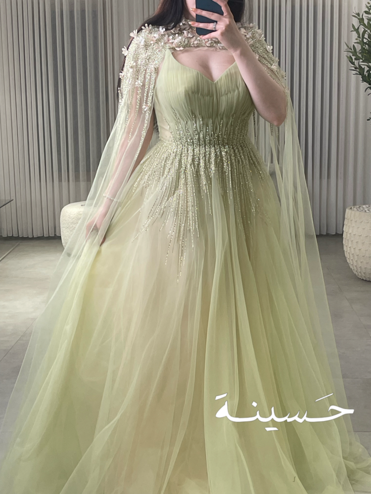فستان تول شيفون أخضر فاتح مطرّز بالكريستال