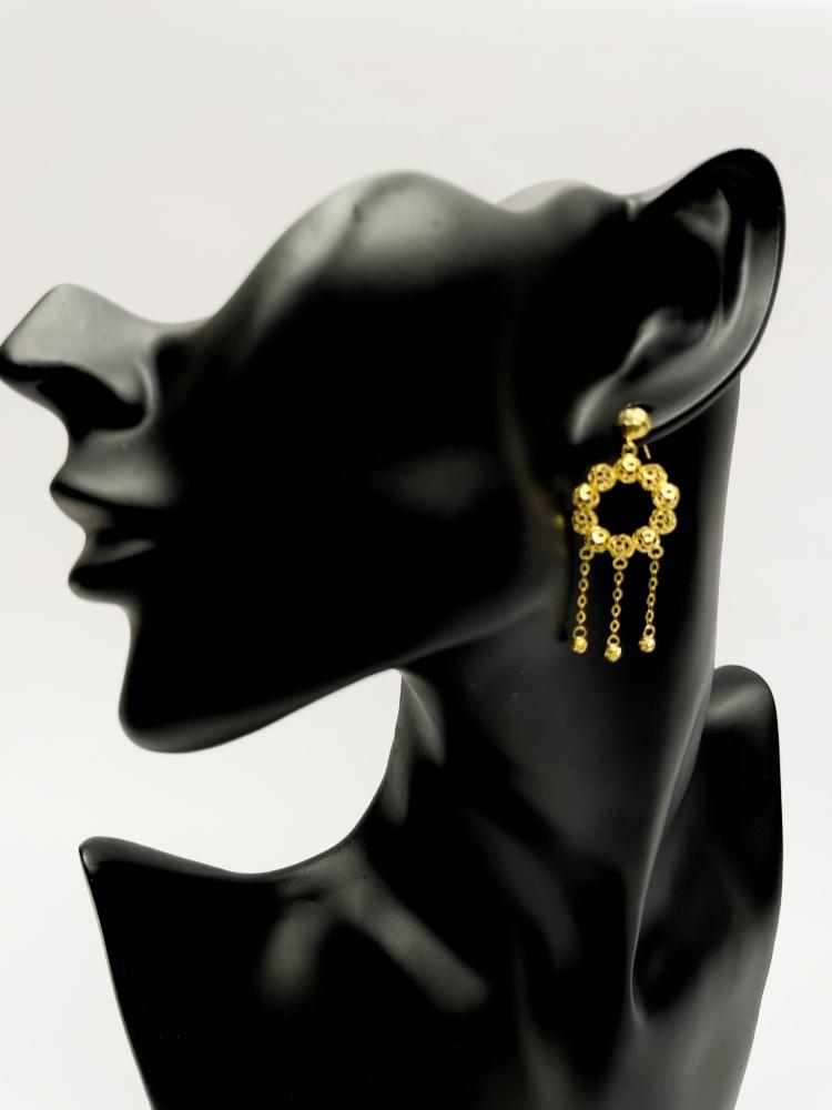 Oriental gold embellished earring - elegant heritage design.