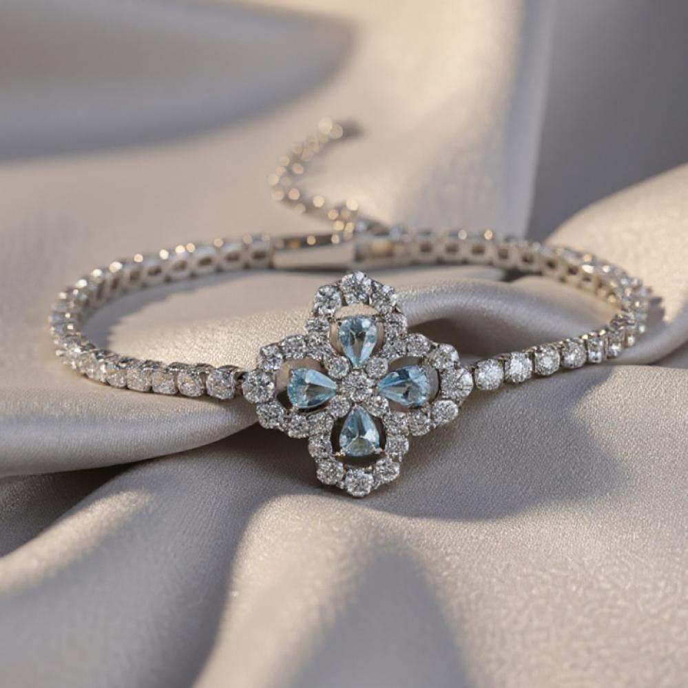 "سوار التنس الفضي مع قلادة الزهرة الزرقاء – بريق يخطف الأنظار"