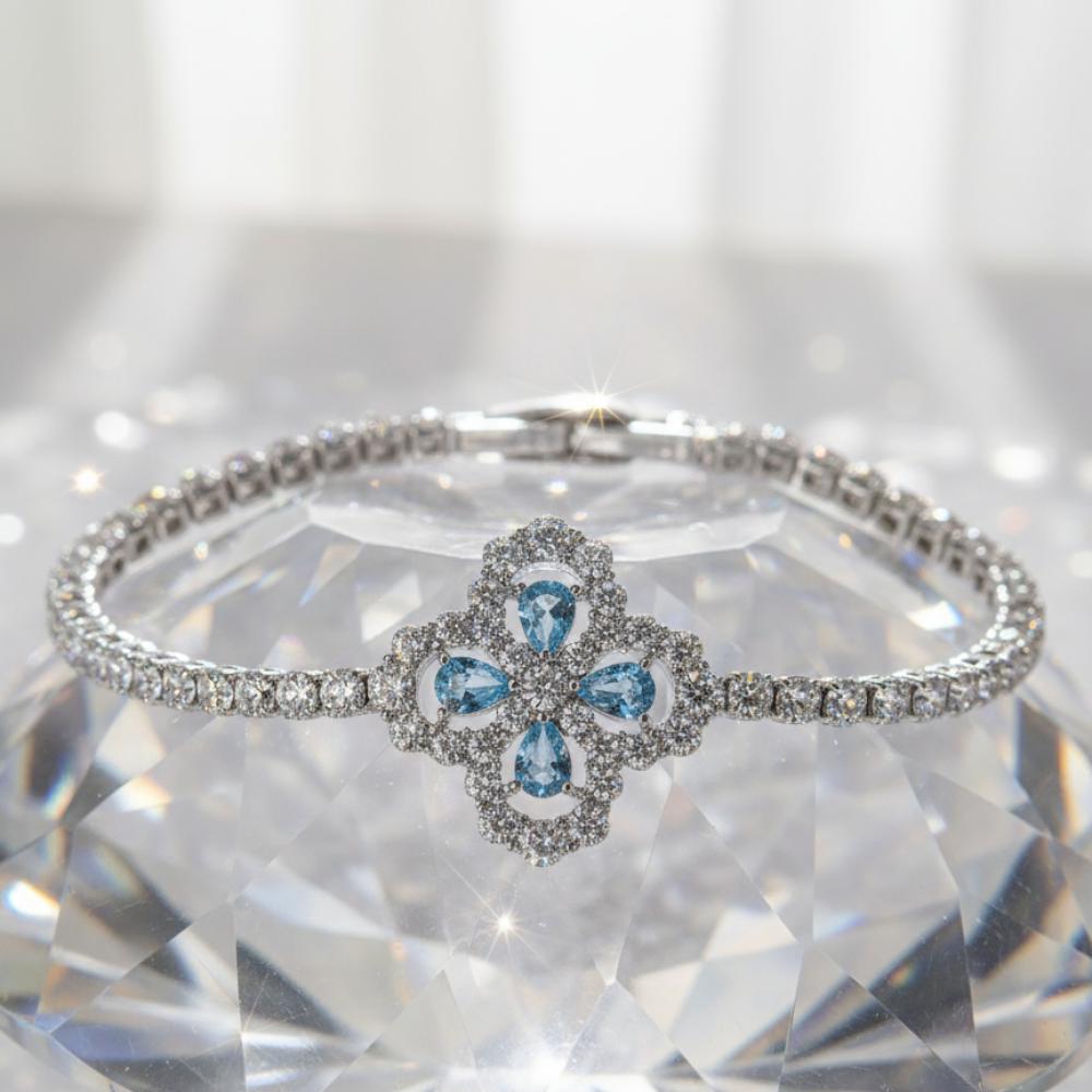 "سوار التنس الفضي مع قلادة الزهرة الزرقاء – بريق يخطف الأنظار"