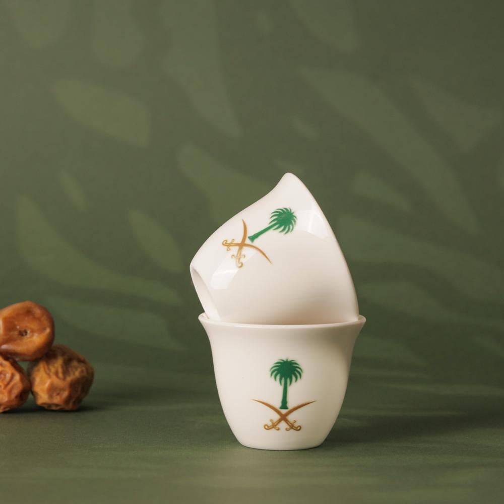 Saudi coffee cups with the logo of two swords and a palm tree