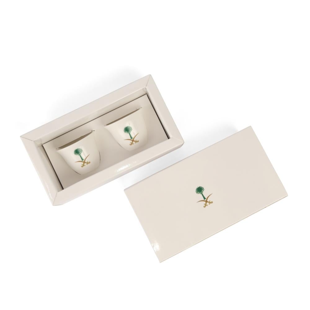 Saudi coffee cups with the logo of two swords and a palm tree