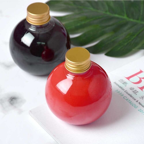 A set of (12) spherical containers for juices and cold drinks with a golden lid