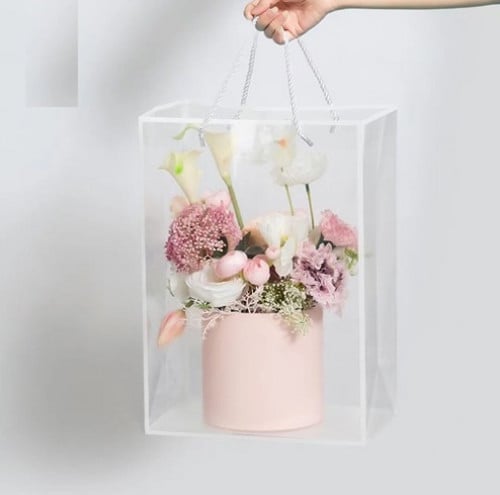 A set of (12) transparent plastic gift bags with a white frame