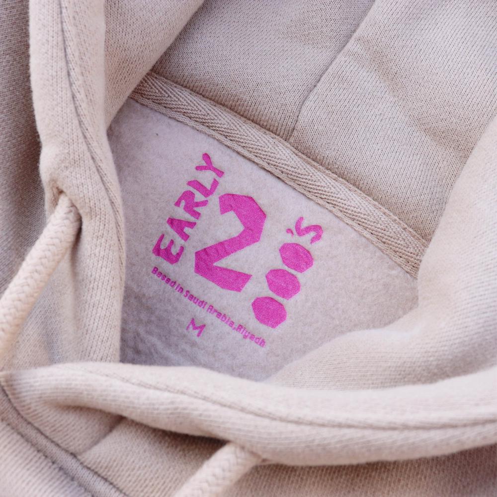 design "الباب يوسع جمل" -  Beige unisex hoodie