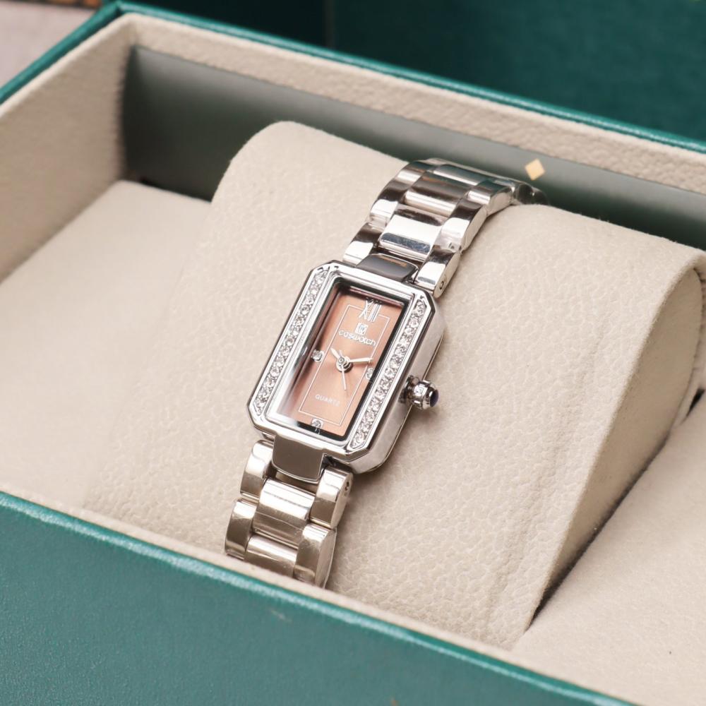 ساعة نسائية مستطيلة بسير ستيل باللون الفضي ميناء بني