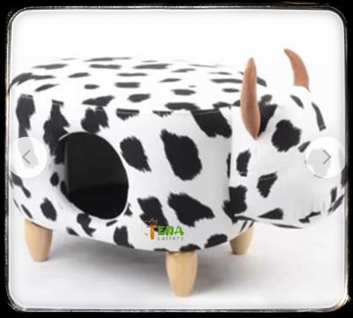 كنبة خشب مغلفة بالجلد الفاخر على شكل بقرة ابيض واسود