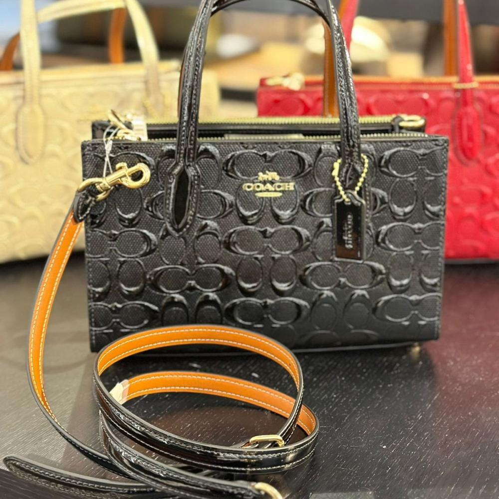 حقيبة كوتش نينا اسود لماع فوري