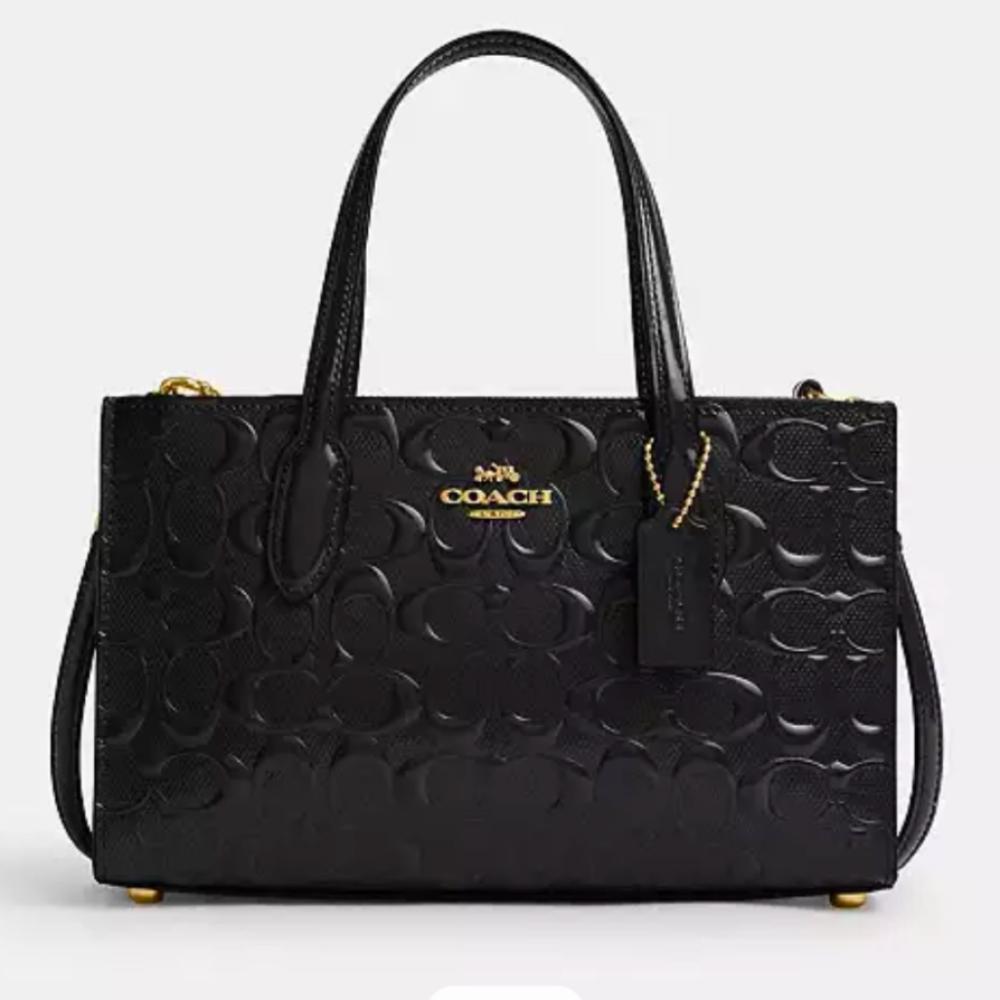 حقيبة كوتش نينا اسود لماع فوري