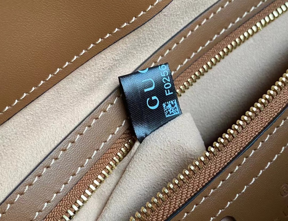 Padlock leather-trimmed printed coated-canvas tote