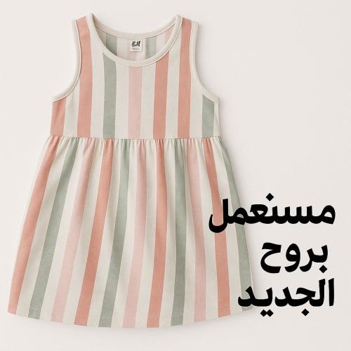 فستان طفولي أنيق بنقشة مخططة بألوان باستيلية هادئة...