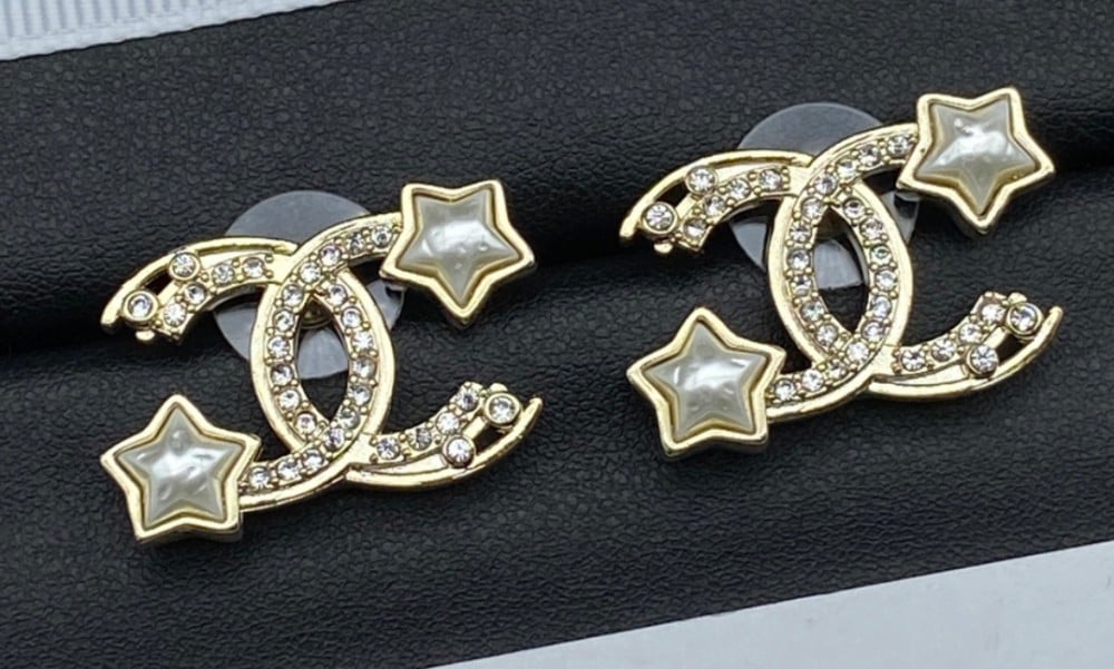 2024 Chanel earrings, a gold stud with the Chanel logo and