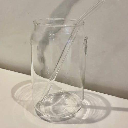 Glass cup with straw