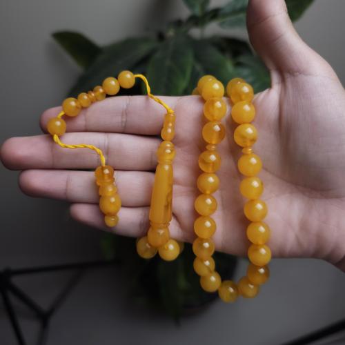 سبحة بكلات اصفر فاتح تمليكة