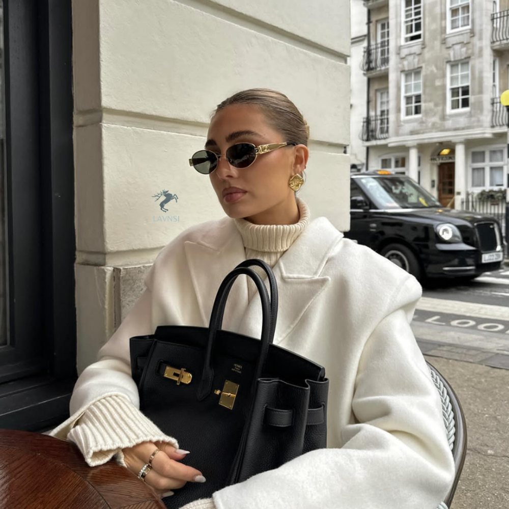 نظارة سيلين المميزة باللون الذهبي وعدسات سوداء