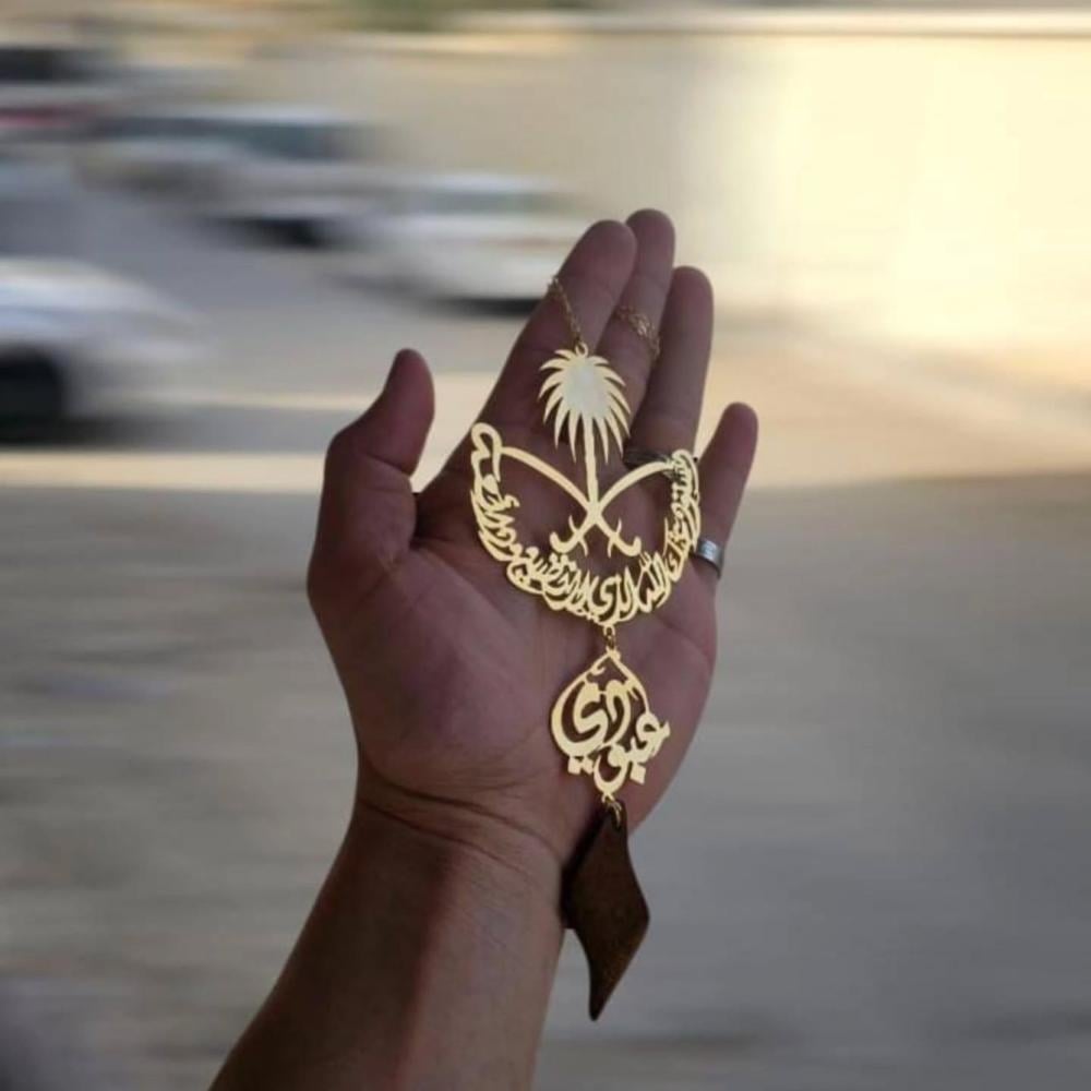 تعليقه سيفين و نخله مع الاسم