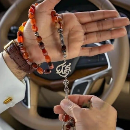 سبحه لون احمر ممزوج باللون البني
