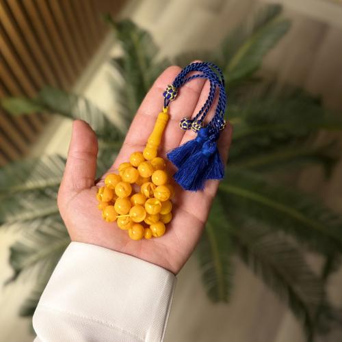 سبحة تراب كهرمان - اصفر كركوشة زرقاء