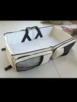 شنطة وسرير أطفال