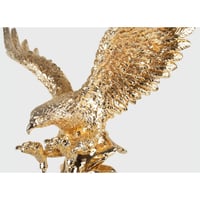 مجسم صقر باللون الذهبي