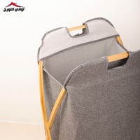 سلة غسيل قماش رمادي بأطار خشبي قابله للطي