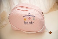 سرير متنقل وردي