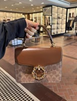 شنطه كوتش بني فاتح كرستال