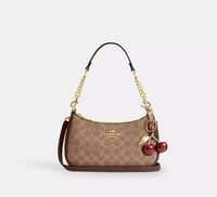 شنطة كوتش تيري بني ذهبي