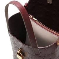 شنطه كارولينا هريرا عنابي