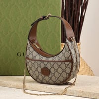 شنطة قوتشي لليد بني