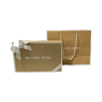 كروس بدي من مايكل كورس باللون الكريمي