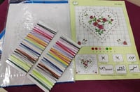 قماش ايتامين مرسوم عليه مع ابرة وخيوط